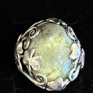 Beautiful green stone set in sterling silver. Size 9 1/4